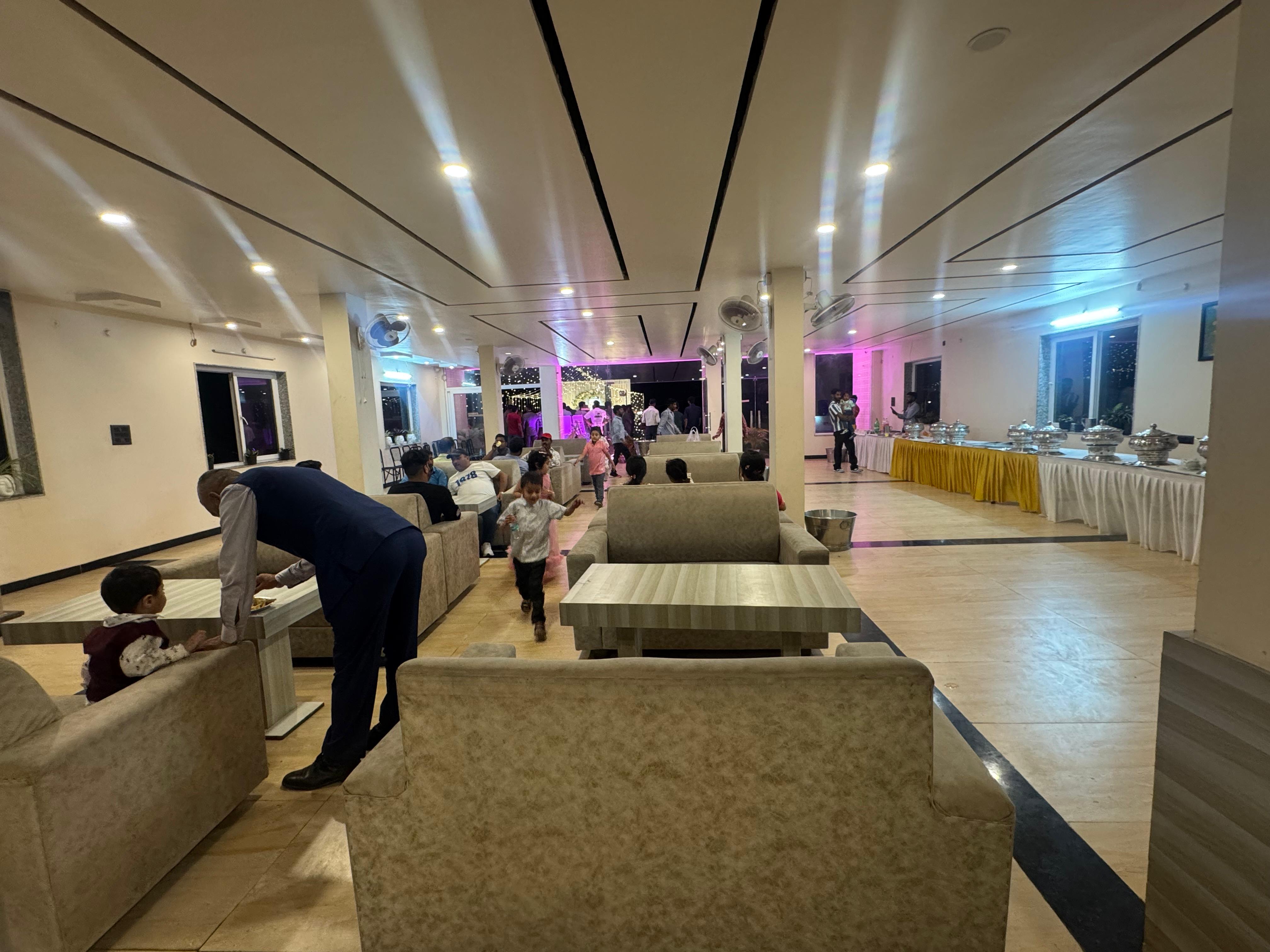 Banquet hall with guests and buffet